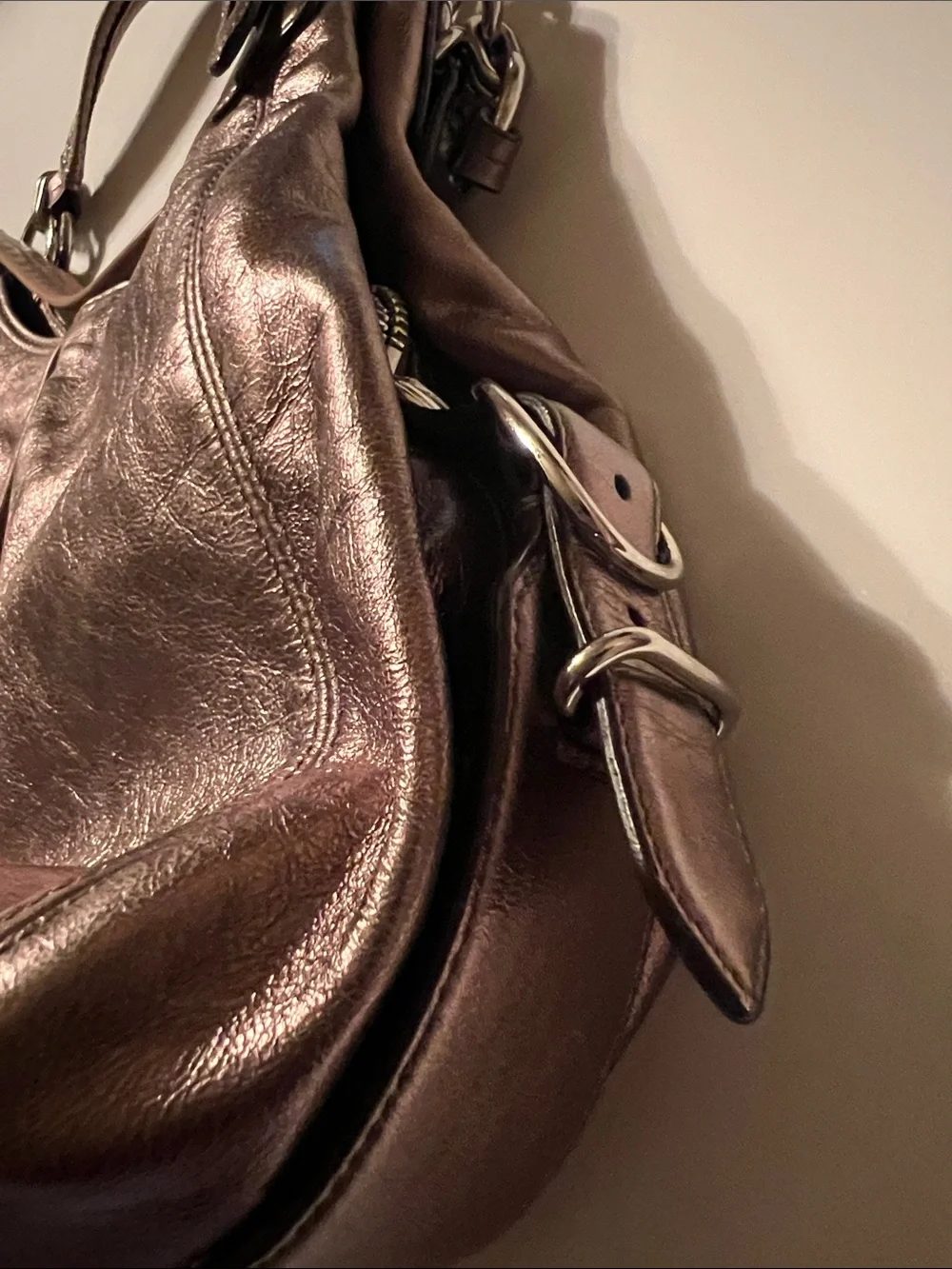 Coach Madison Maggie hobo shoulder bag featuring a metallic gunmetal leather